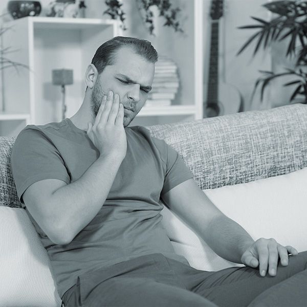 A man experiencing tooth pain